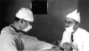 Walter Freeman (right) performing a lobotomy with his surgical partner James Watts